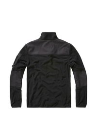 Svart fleecejakke med kontrasterende glatt stoff på skuldre og ermer, høy krage og en lomme på venstre erme. Strukturert overflate.