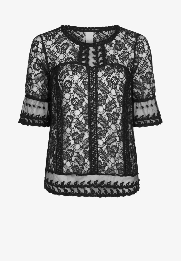 Blouse noire en dentelle à manches courtes avec motif floral, bords festonnés et panneaux en mesh transparent sur les manches et l'ourlet.