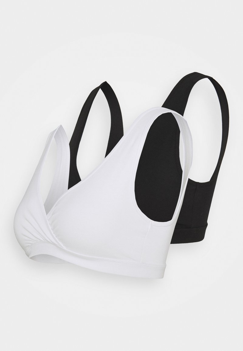 Two soft cotton bras in white and black. Both feature a scoop neckline and wide straps with smooth seams. Textured fabric enhances comfort.