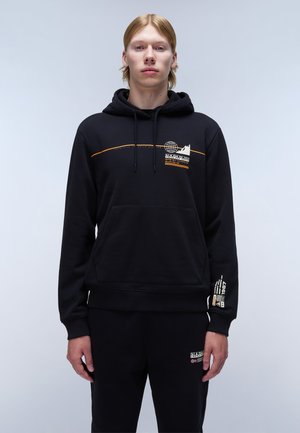 Black hooded sweatshirt in soft fabric, featuring an orange graphic design, front pocket, and ribbed cuffs. Paired with matching black joggers.
