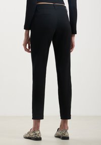 Calliope Chino - nero
