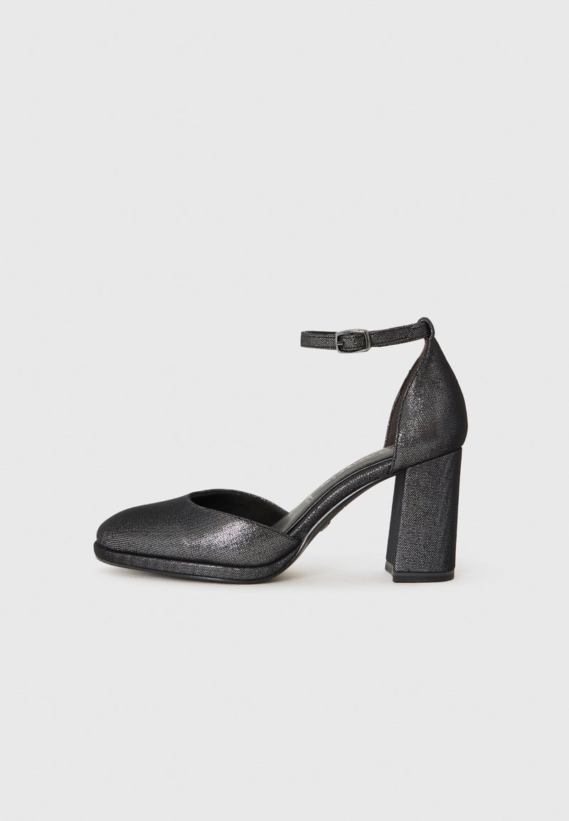 Black textured heel shoe with a rounded toe, ankle strap, and a block heel. The material has a slight shine and a smooth finish.
