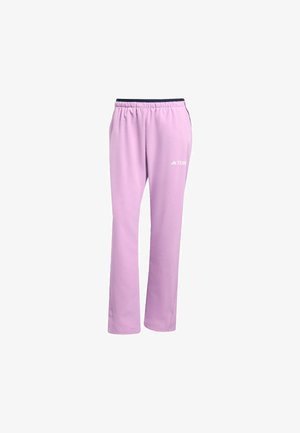 Pantaloni sportivi color lilla chiaro realizzati in tessuto morbido, con vita elastica, gambe dritte e un logo bianco sul lato sinistro.