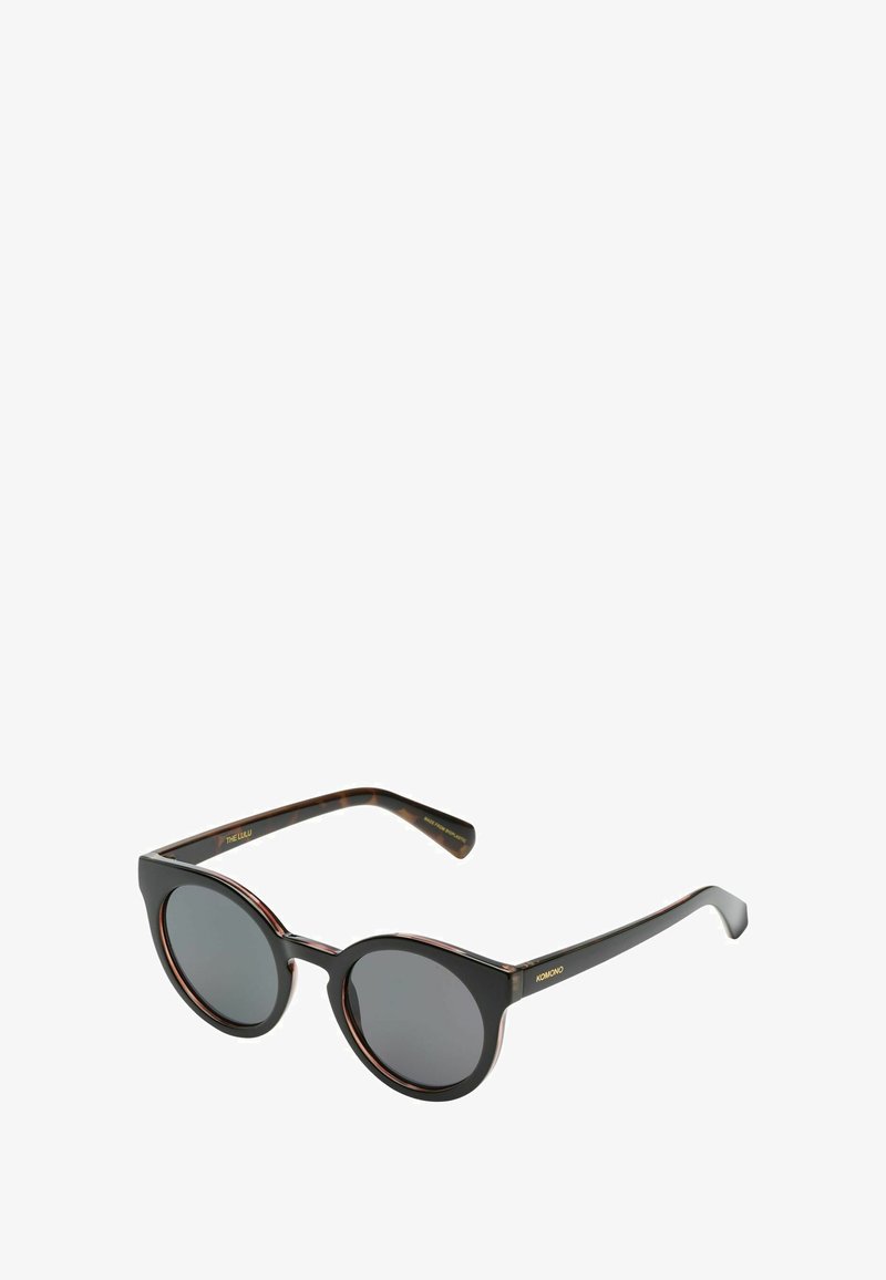 Ronde zonnebrillen met zwarte monturen, grijze lenzen en subtiele schildpadmotieven op de veren. Strak, matte afwerking met een glanzend detail.