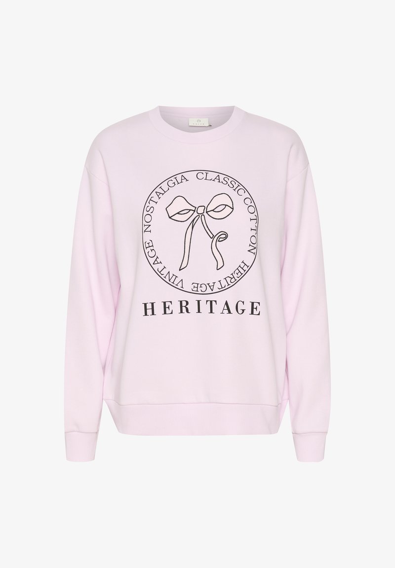 Hanorac din bumbac roz deschis, cu un grafic central ce include un fundiță și textul "HERITAGE" dedesubt. Design simplu cu o croială lejeră.