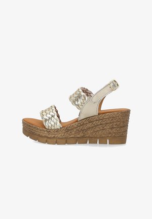 Kilesandal med flettet korksål, metallisk vævet front og ankelremme, samt justerbar sidespænde.