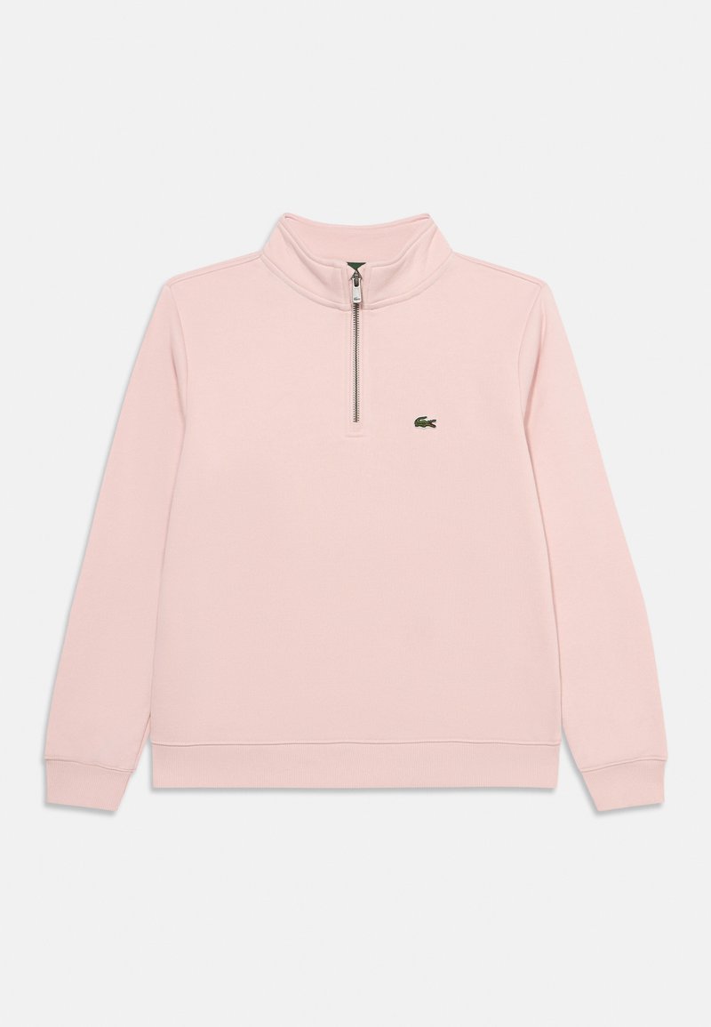 Sweat-shirt rose clair à fermeture éclair quart, manches longues et petit logo crocodile vert sur la poitrine.