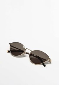 Black oval sunglasses with a thin gold metal frame and black arms. Dark tinted lenses with a double bridge design.