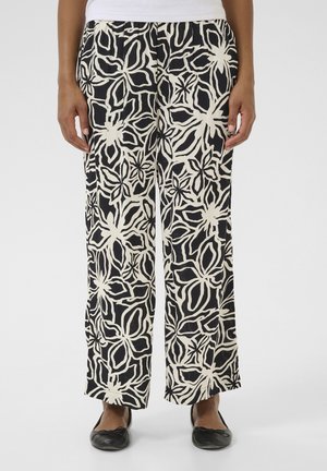 Pantalons à jambes larges en noir et crème avec un motif floral, tissu léger, taille élastique et coupe décontractée.