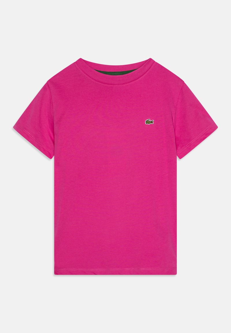 T-shirt di cotone fucsia con scollatura rotonda e maniche corte. Caratterizzato da un piccolo logo ricamato verde sul petto. Texture liscia.