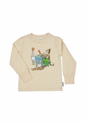 Beige langærmet skjorte med illustration af kat i grønne bukser, der sidder ved et blåt bord og spiser sammen med to stående høns.