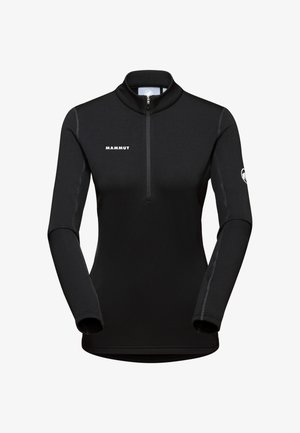 Svart långärmad pullover med kvartszipp. Tillverkad av töjbart material, med kontrasterande sömmar och en logo på bröstet och ärmen.