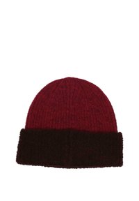 Red knitted beanie with a folded dark brown fuzzy cuff, isolated on a white background.