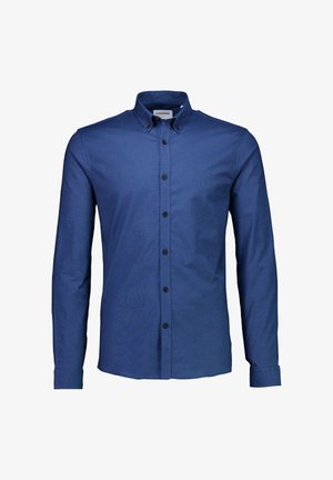 Chemise à manches longues, boutonnée, en tissu bleu foncé. Présente un col boutonné et des boutons noirs. Texture lisse, coupe ajustée.