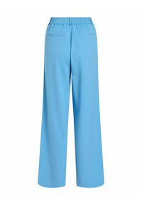 Lyseblå bukser med vide ben, elastisk taljebånd og to baglommer, som har en blød tekstur og en løs pasform for komfort.