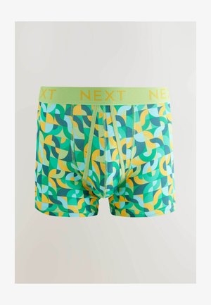 Žalios bokso kelnaitės su geometrišku raštu, kuriame yra žalios, geltonos ir mėlynos spalvos. Šviesiai žalios spalvos juosmuo su užrašu "NEXT" geltonai.