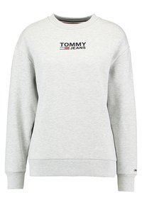 Light gray crewneck sweatshirt with "TOMMY JEANS" logo and small flag emblem on cuff, ribbed collar, cuffs, and hem.