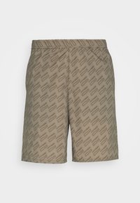 Shorts beiges avec un motif géométrique subtil sur l'ensemble. Fabriqués dans un matériau léger, avec une taille élastique pour plus de confort.