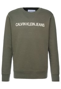 Felpa verde oliva realizzata in tessuto morbido, con scollo rotondo e polsini a costine. Logo "CALVIN KLEIN JEANS" stampato in bianco sul davanti.