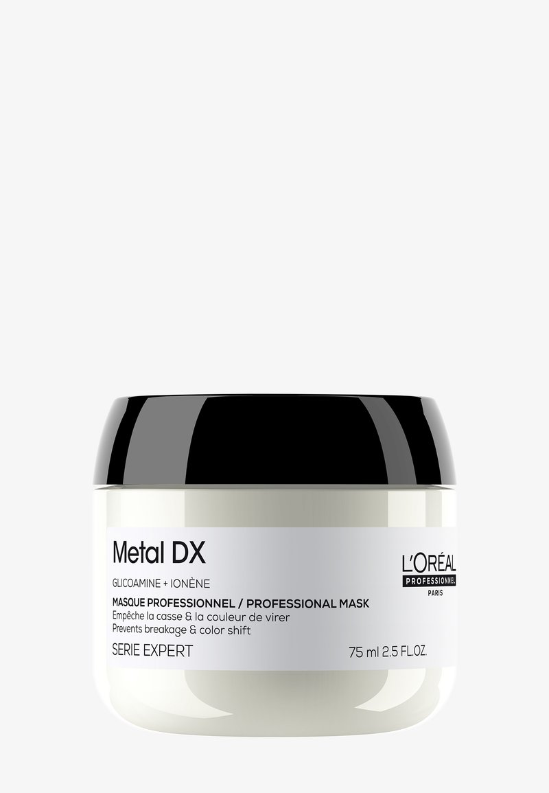 Pot blanc avec couvercle noir étiqueté Masque professionnel Metal DX de L'Oréal, prévient la casse des cheveux et le décalage des couleurs, contenant de 75 ml.