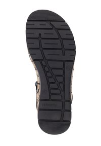 Semelle en caoutchouc noir avec un motif texturé comprenant des rainures et des crêtes, étiquetée avec la taille 37 et la marque "remonte."