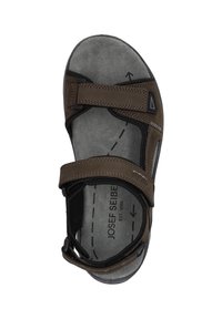 Sandalini marroni con due chiusure a strappo regolabili e una soletta interna testurizzata e supportiva. Presentano una forma arrotondata e una suola in gomma resistente.