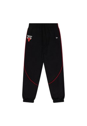 Black jogger pants with red accents, elastic waistband, and Chicago Bulls logo embroidery on the upper left side. Crafted from soft material.