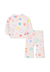 Twee-delig outfit met een lichtroze sweatshirt en bijpassende legging, beide versierd met kleurrijke patronen van wolken, bloemen en glimlachende gezichten.