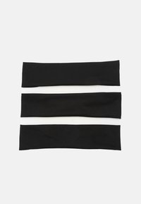 Set of three elastic headbands in black and white, with a smooth texture and a simple, flat design. Each band is uniform in width.