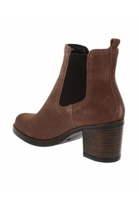 Bottines en suède marron avec panneau latéral en élasthanne, languette à l'arrière et talon bloc empilé.