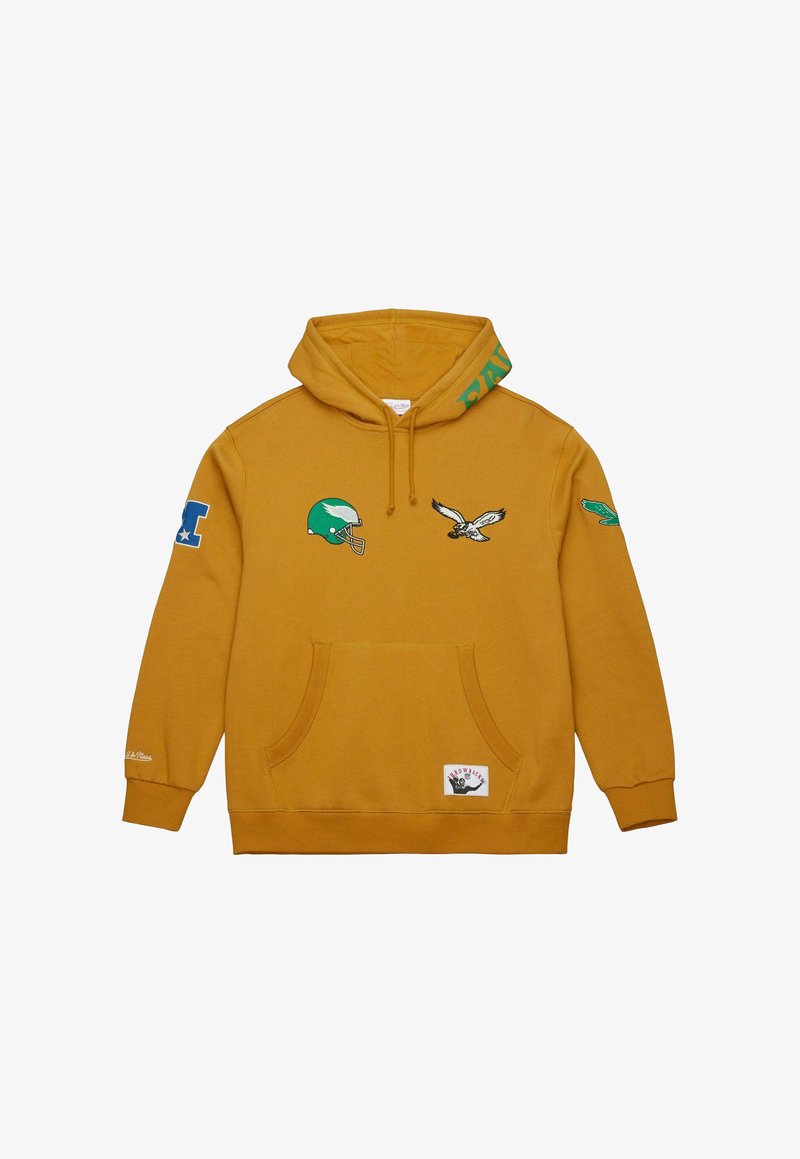 Haut en jaune avec une poche kangourou à l'avant et des patches brodés comprenant un casque de football vert, un aigle et des accents décoratifs.