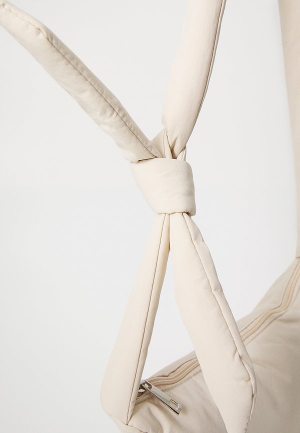 PCAMANDA KNOT BUMBAG - Cross body bag - sandshell2