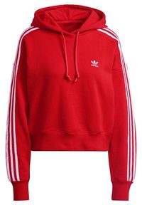 Red hooded sweatshirt made of soft fabric, featuring white stripes along the sleeves and a small white logo on the chest.