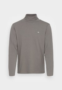 Hellgraues Langarmshirt mit Rollkragen aus weichem Stoff, verfügt über ein eng anliegendes Design und ein kleines weißes Logo auf der Brust.