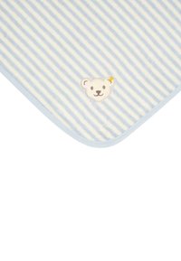 Striped blue and white fleece blanket with a soft texture, featuring a stitched bear face patch and rounded corners.