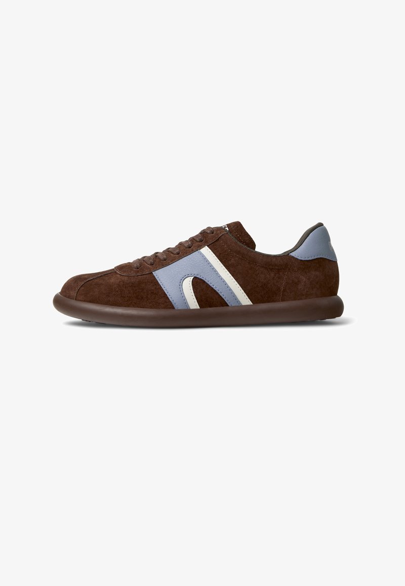 Brown suede sneaker with blue and white accents, rounded toe, rubber sole, and lace-up design. Smooth texture and low profile.