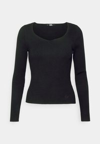 Svart ribbad långärmad topp med en figurnära passform och djup V-ringning. Diskret logotypnear nederkanten. Mjuk textur.