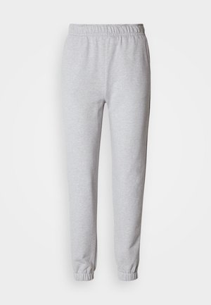 Pantalones deportivos gris claro hechos de una mezcla suave de algodón. Cuentan con una cintura elástica y puños en los bajos. Diseño sencillo y sin adornos.