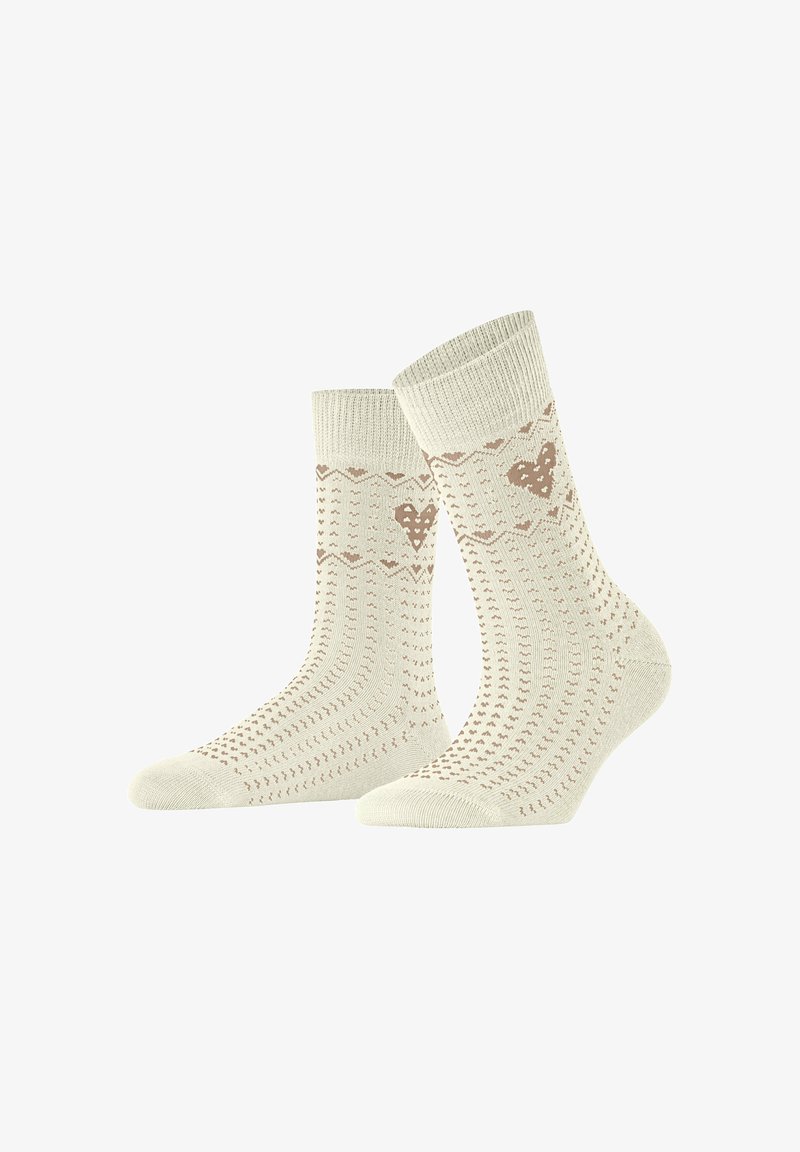 Gebreide sokken in crème met een patroon van harten en zigzagaccenten. Getextureerde ribbelmanchet en versterkte teen voor duurzaamheid.