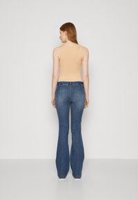 ONLY Tall ONLWAUW MID FLARED ZIP CUT - Vaqueros bootcut - medium blue denim