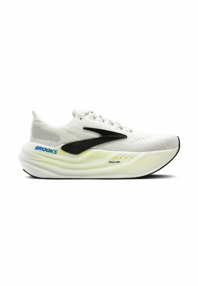 White athletic shoe with black accents, mesh upper, rounded sole, and vibrant neon detail. Features lace closure and perforated design.