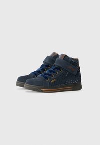 Navy blue high-top shoes made of suede with perforated detailing, featuring blue laces and a Velcro strap for fastening, textured rubber sole.