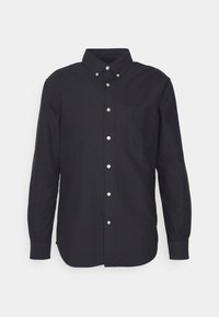 Camicia nera a maniche lunghe con bottoni realizzata in cotone. Presenta un colletto, una tasca sul petto e bottoni argentati sul davanti. Texture liscia.