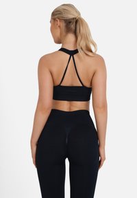 SQUATPROOF Sujetadores deportivos con sujeción media - black