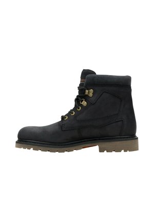 Black leather lace-up work boot with padded ankle collar and brown rubber lug sole, shown from the side on a white background.