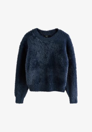 Tumši zils, pūkains džemperis ar apaļu kaklu, garām piedurknēm un īsāku apakšmalu. Tam ir mīksta tekstūra ar nedaudz nevienmērīgu virsmu.