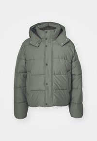 Green puffer jacket with a hood, made of quilted fabric. Features snap buttons, side pockets, and a textured finish.