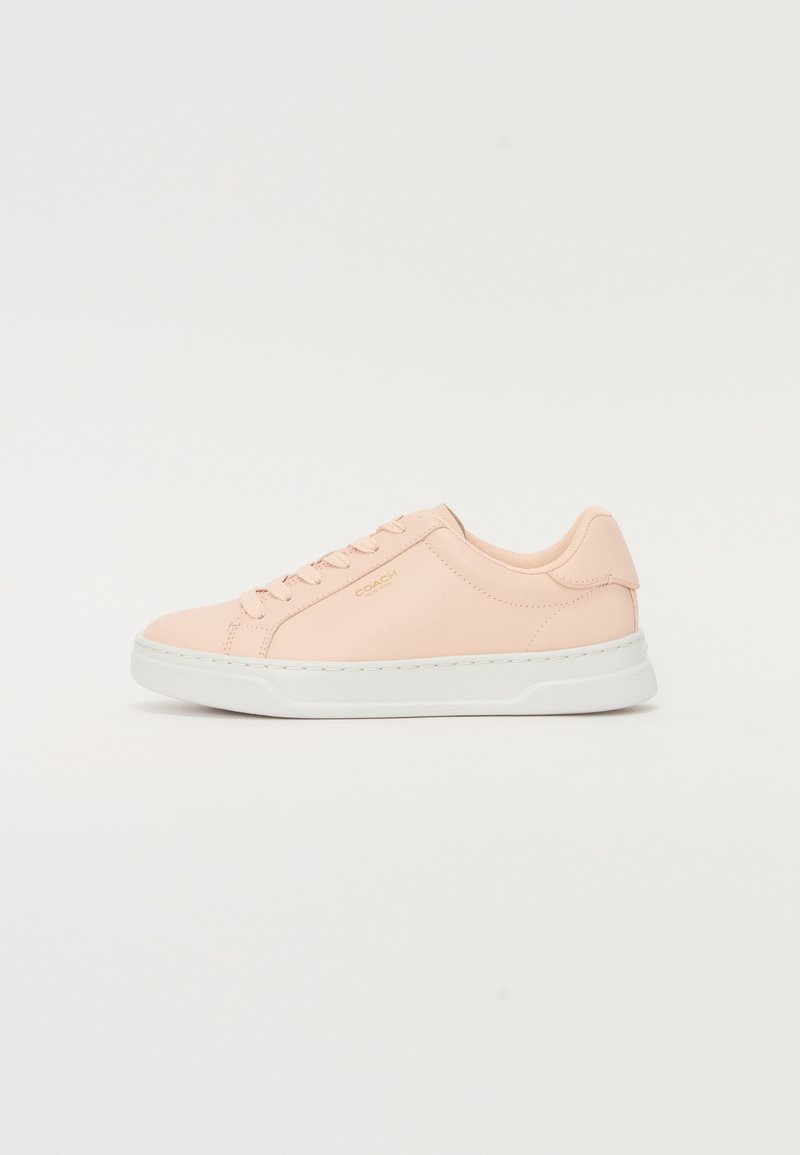 Light pink leather sneaker with white rubber sole, rounded toe, lace-up design, and minimal branding. Smooth texture, casual athletic style.