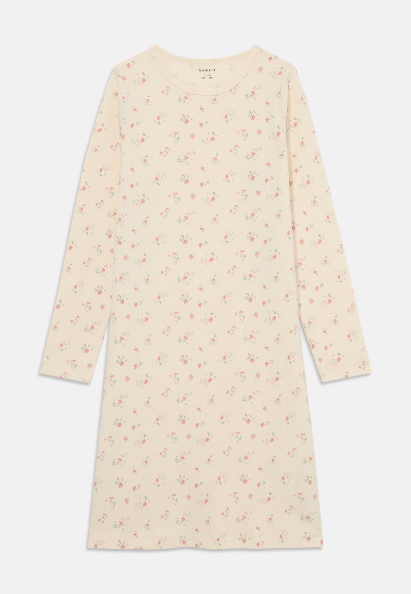 Vestido de manga larga en suave algodón crema con pequeño estampado floral en rosa. Presenta un escote redondo y un ajuste holgado.