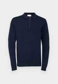 Pull bleu marine avec manches longues, col replié et patte de quart zippée. Confectionné en matériau tricoté doux avec une texture lisse.